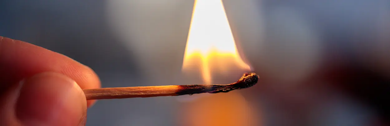 Photo of the burning match by Salah Ait Mokhtar on Unsplash